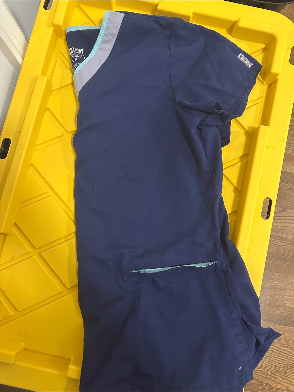 Women’s Grey’s Anatomy scrub top, navy blue with teal features